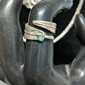 Sweet sterling silver feather wrap around ring.